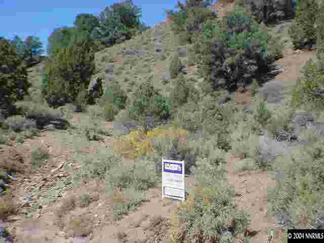 2526 Cartwright Road Reno, NV 89521 - Photo 2 of 2 a sign that is on a brick wall