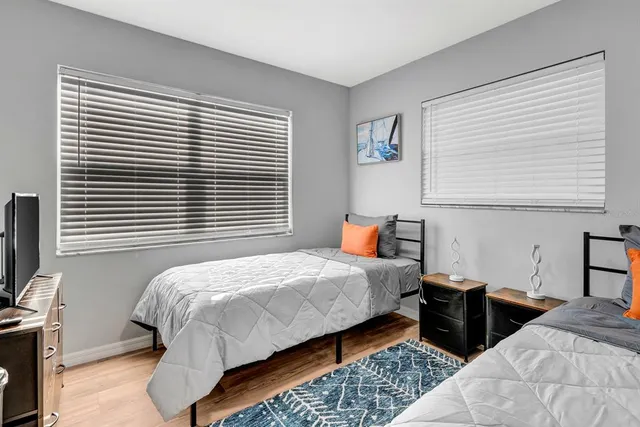 a bedroom with bed and a window