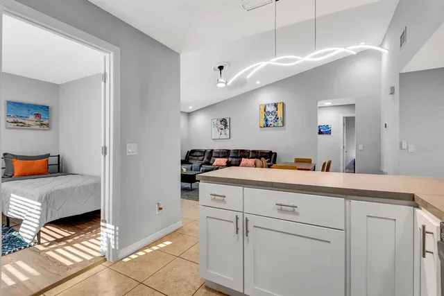a spacious bathroom with a sink and a mirror