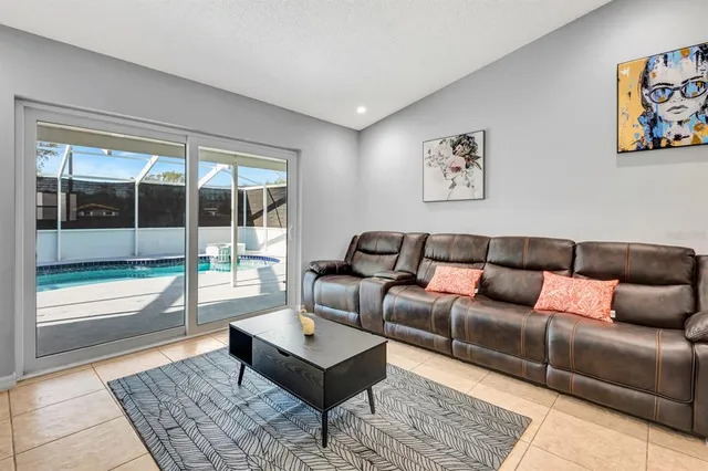 a living room with furniture and a rug