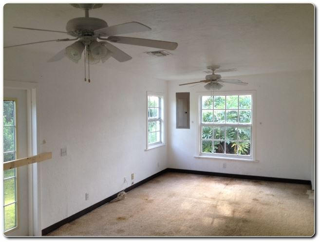328 Shady Lane Road Palm Springs, FL 33461 - Photo 35 of 50 an empty room with windows and fan