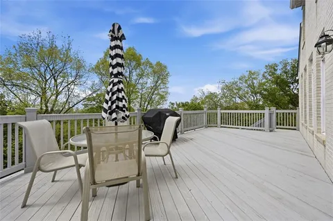a view of a chairs and table on the deck