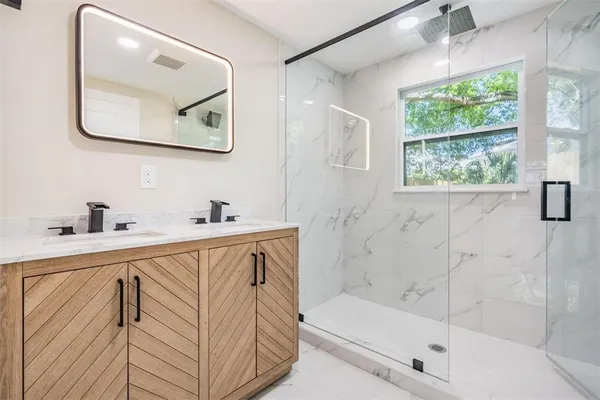 a bathroom with a bathtub and a sink