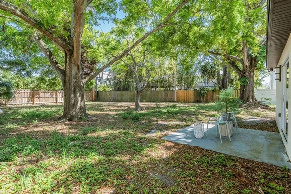 a backyard of a house with lots of green space