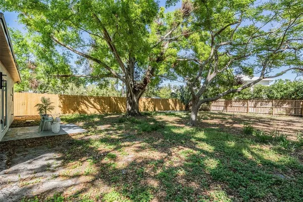 a backyard of a house with lots of green space