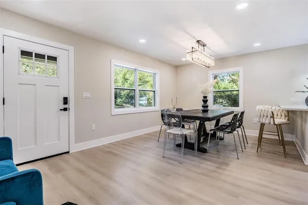 a view of a dining room with furniture window and wooden floor