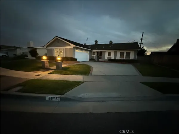 a front view of a house with yard