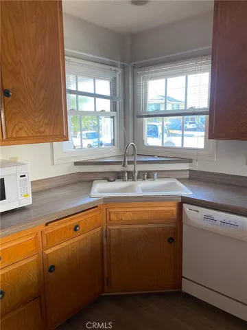 a kitchen with sink cabinets and a window