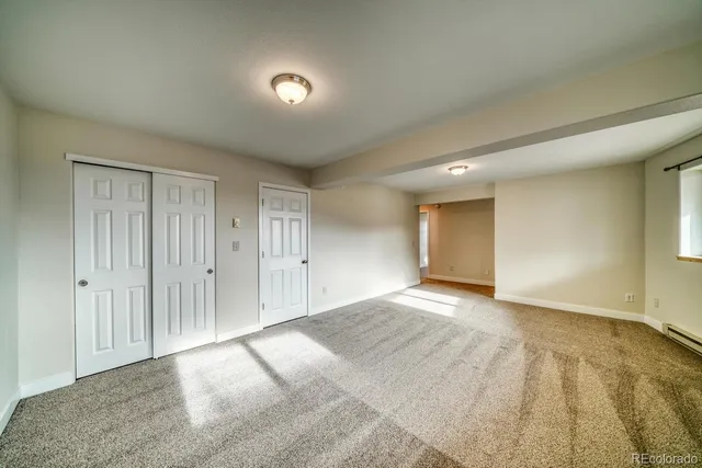 a view of an empty room and window
