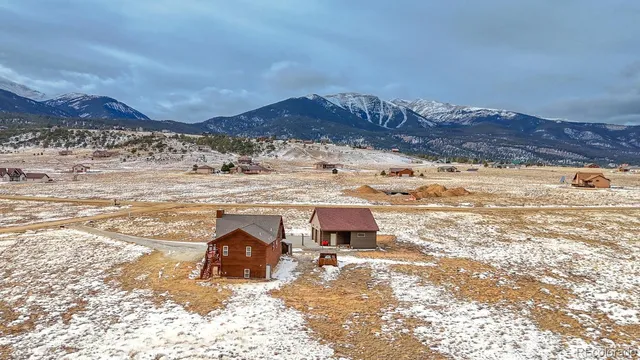 a view of a terrace with wooden floor and a floor to ceiling window