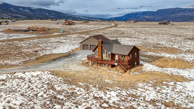 a view of a backyard with wooden fence