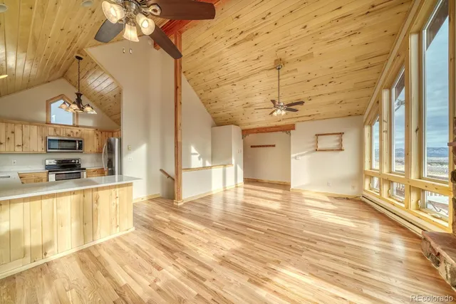 a view of a kitchen with a stove and cabinets