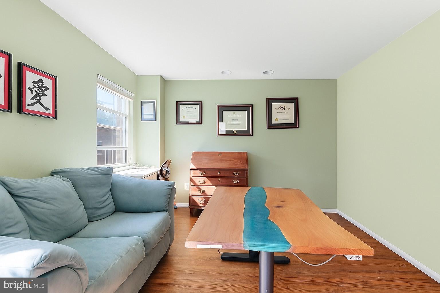 514 Randolph Court, Unit C Philadelphia, PA 19147 - Photo 3 of 10 a living room with furniture and a wooden floor