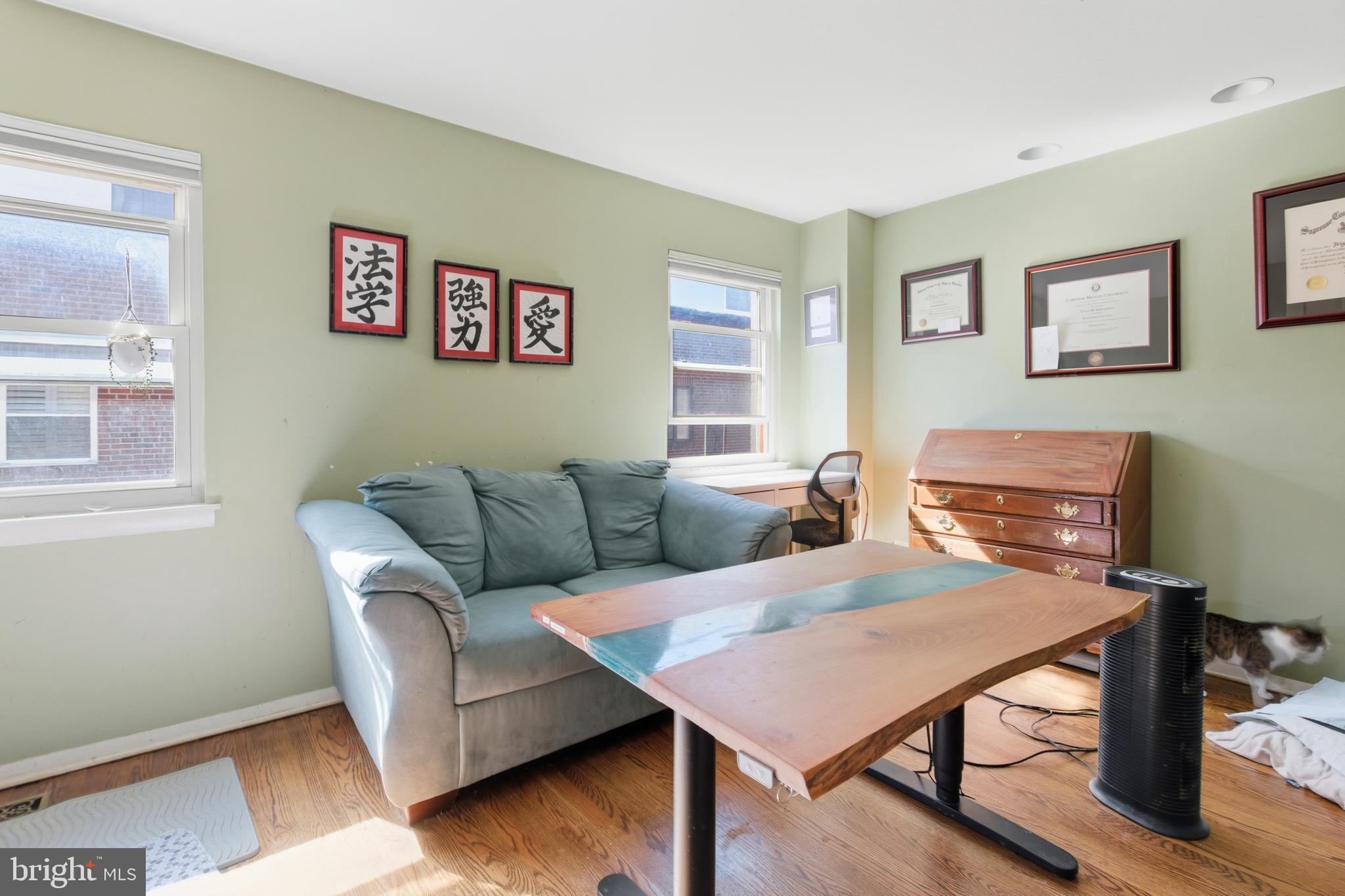514 Randolph Court, Unit C Philadelphia, PA 19147 - Photo 4 of 10 a living room with furniture and a wooden floor