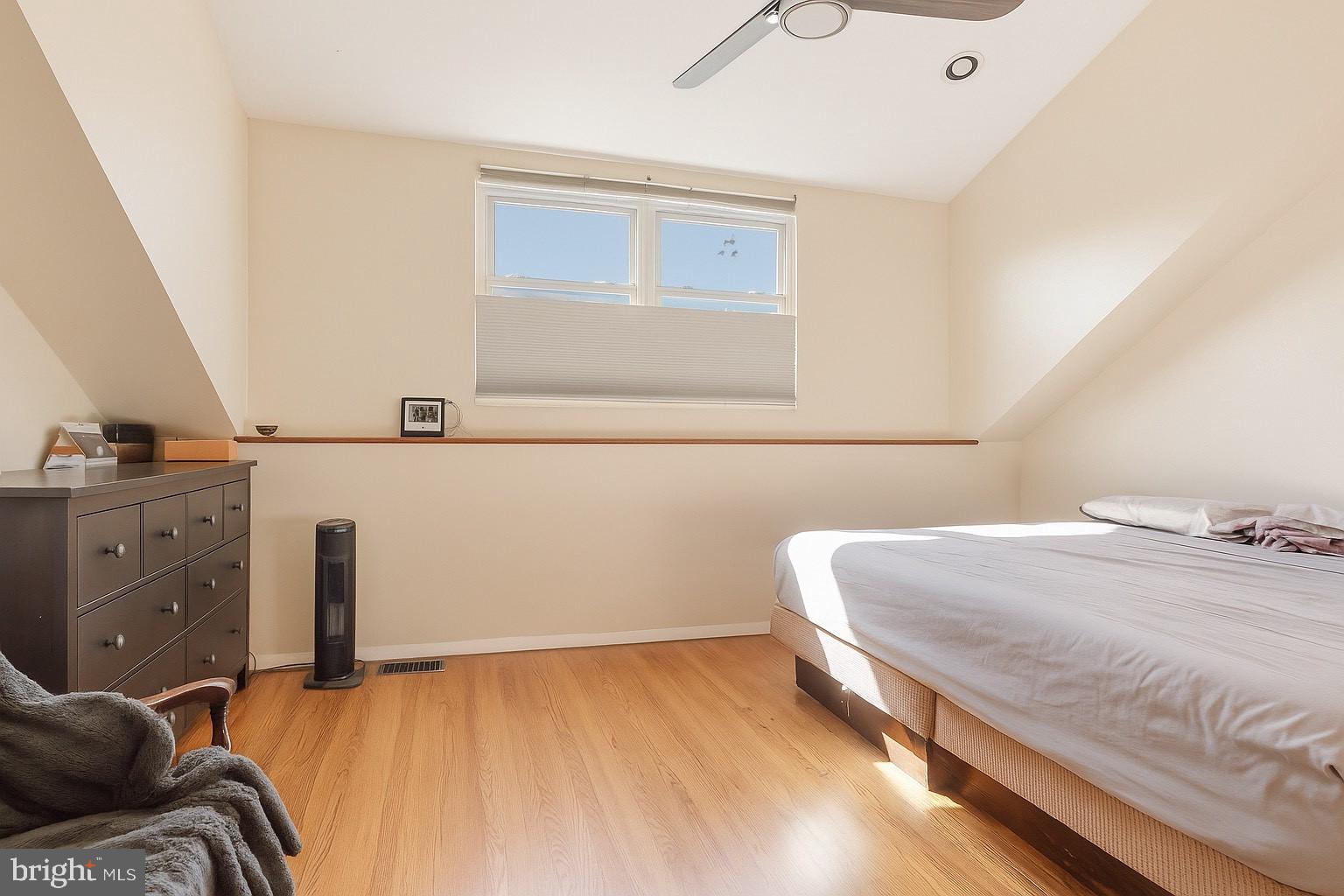 514 Randolph Court, Unit C Philadelphia, PA 19147 - Photo 5 of 10 a bedroom with a bed and window