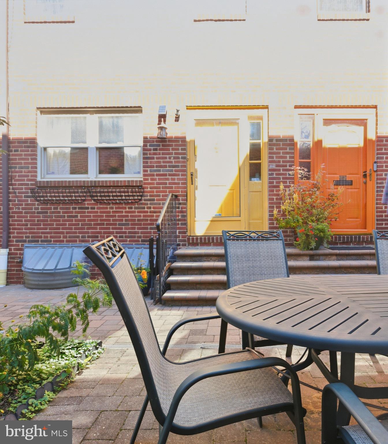 514 Randolph Court, Unit C Philadelphia, PA 19147 - Photo 9 of 10 an outdoor sitting area with a table and chairs