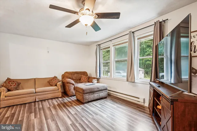 a living room with furniture and a window
