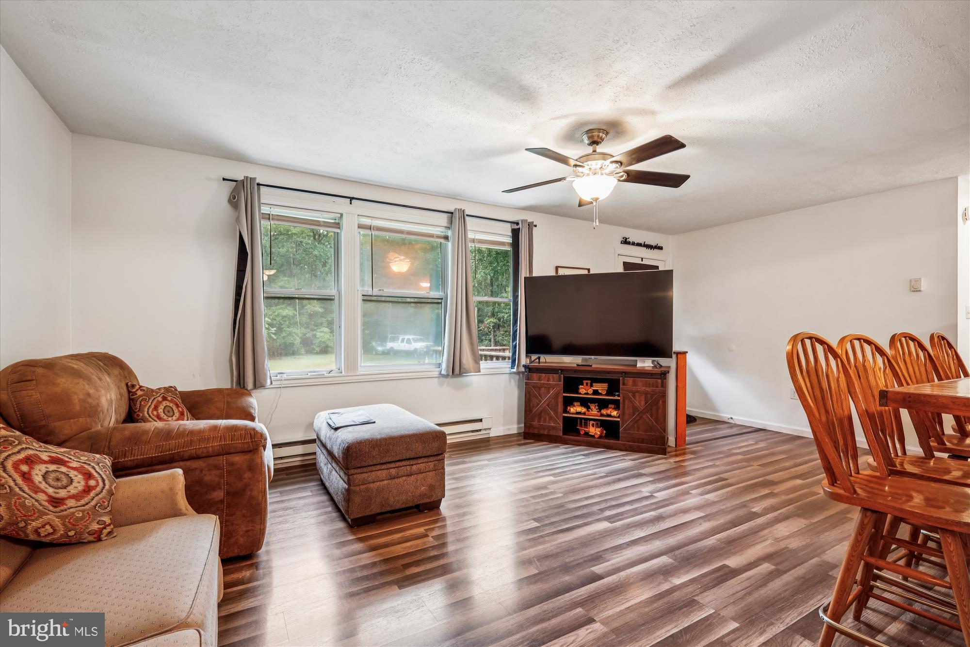 26623 Bee Tree Road Henderson, MD 21640 - Photo 14 of 33 a living room with furniture and a flat screen tv