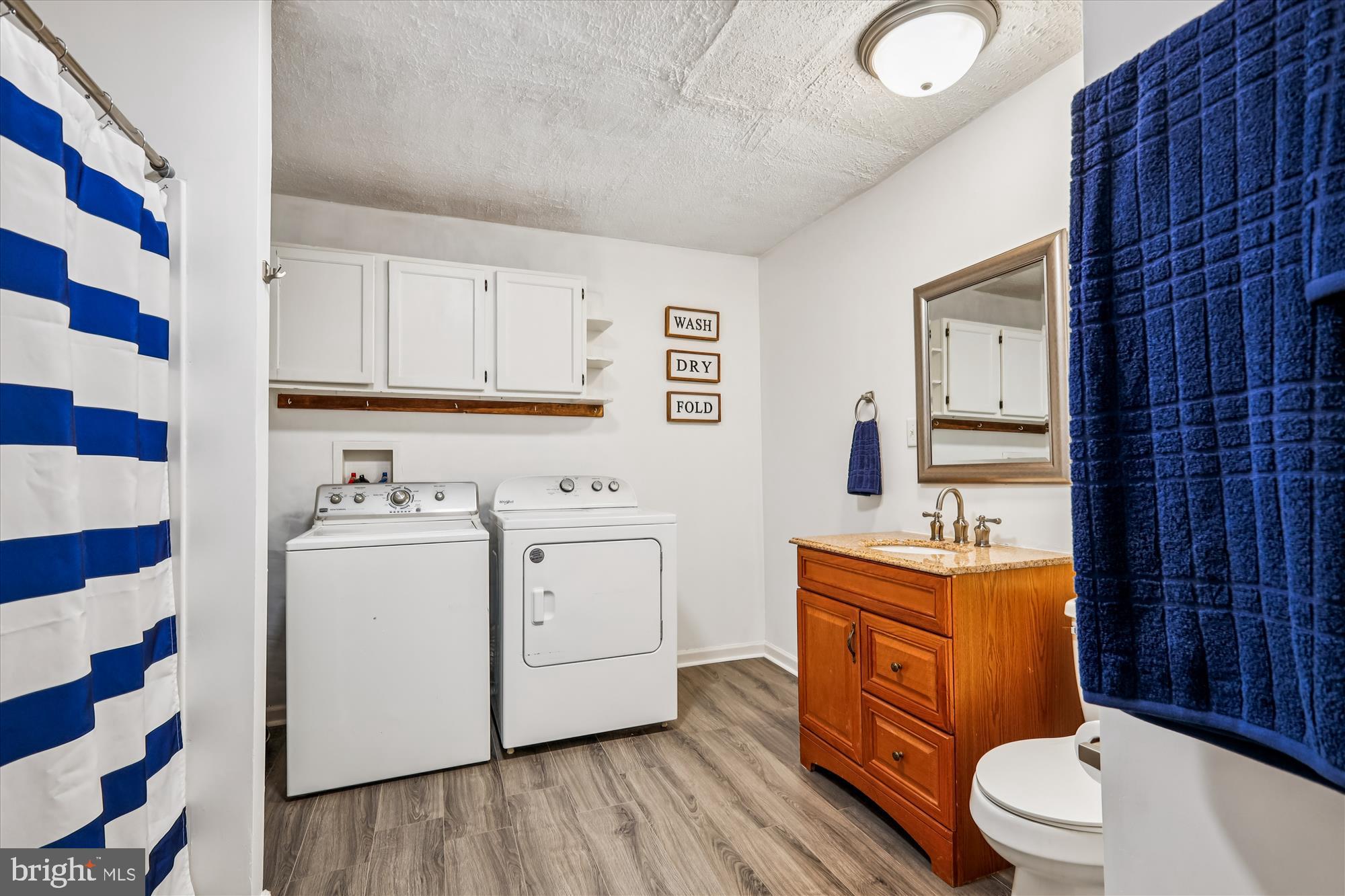 26623 Bee Tree Road Henderson, MD 21640 - Photo 20 of 33 a view of bathroom with a toilet a sink and a mirror