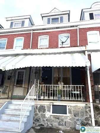 a view of a balcony with a floor to ceiling window