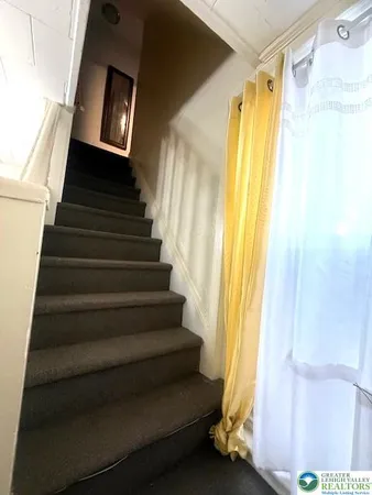 a view of entryway with wooden floor and door