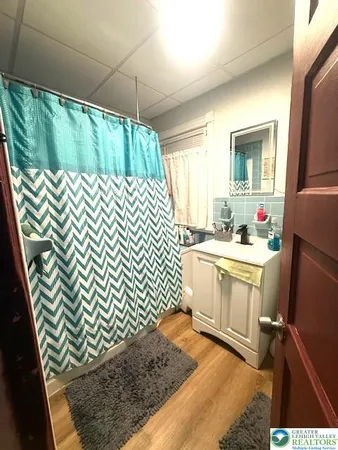 a kitchen with a sink a stove and cabinets