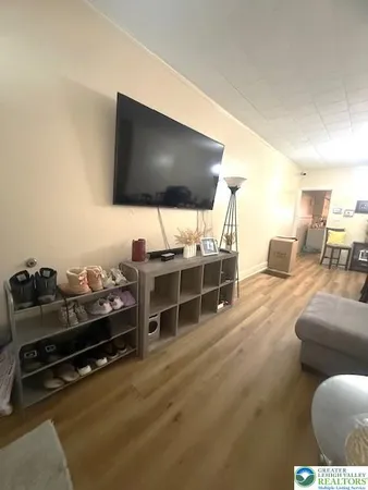 a room with furniture and a flat screen tv
