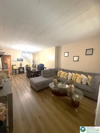 a living room with furniture and a table