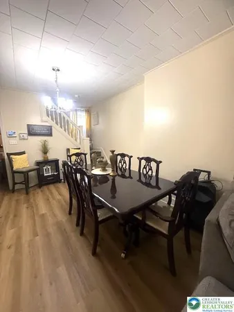 a dinning table and chairs in a room