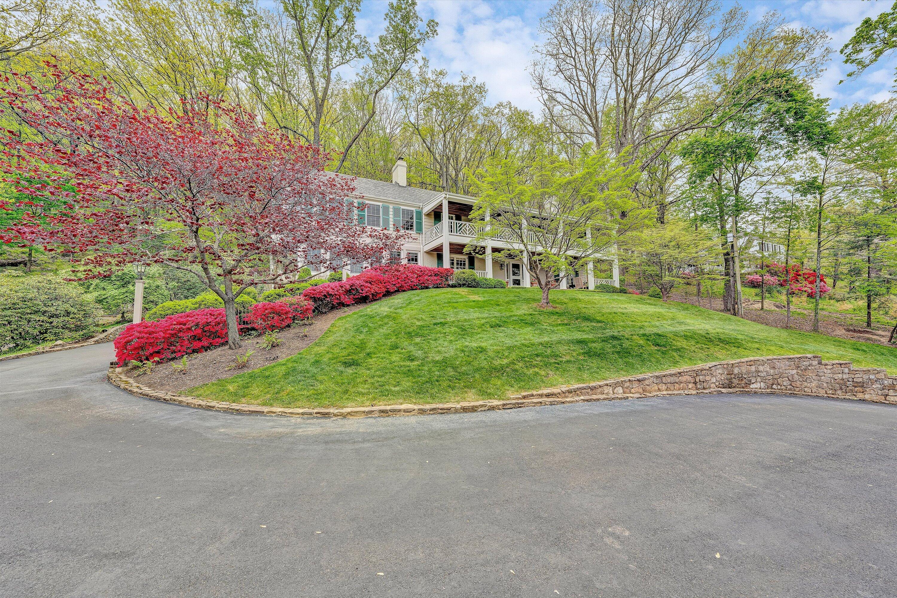 2438 Robin Hood Road Southeast Roanoke, VA 24014 - Photo 4 of 81 a view of a white house with a big yard and a large trees