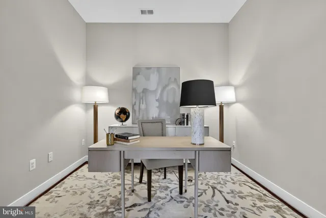 a bathroom with a granite countertop sink mirror and a shower