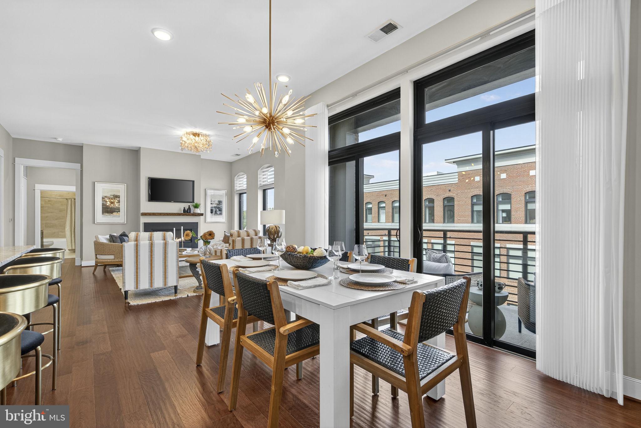 3 Stationmaster Street Southeast, Unit 402 Leesburg, VA 20175 - Photo 44 of 46 a view of a dining room with furniture window and wooden floor
