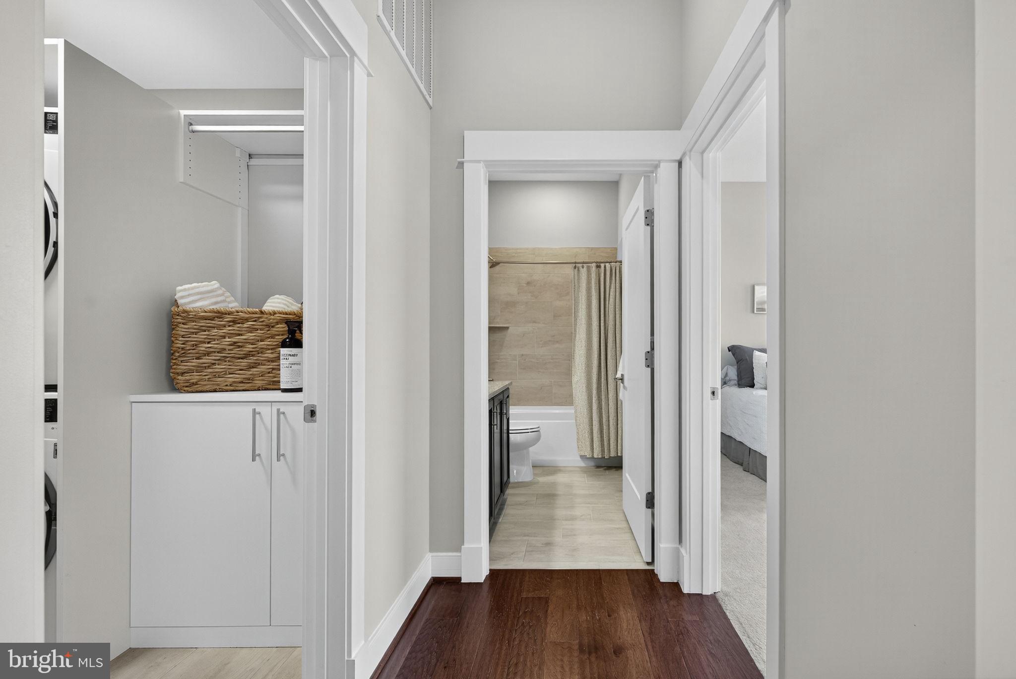3 Stationmaster Street Southeast, Unit 402 Leesburg, VA 20175 - Photo 20 of 46 a view of a hallway with wooden floor