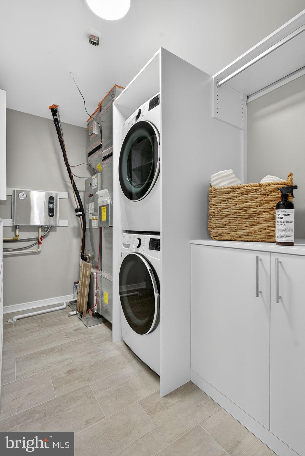 3 Stationmaster Street Southeast, Unit 402 Leesburg, VA 20175 - Photo 26 of 46 a utility room with dryer and washer