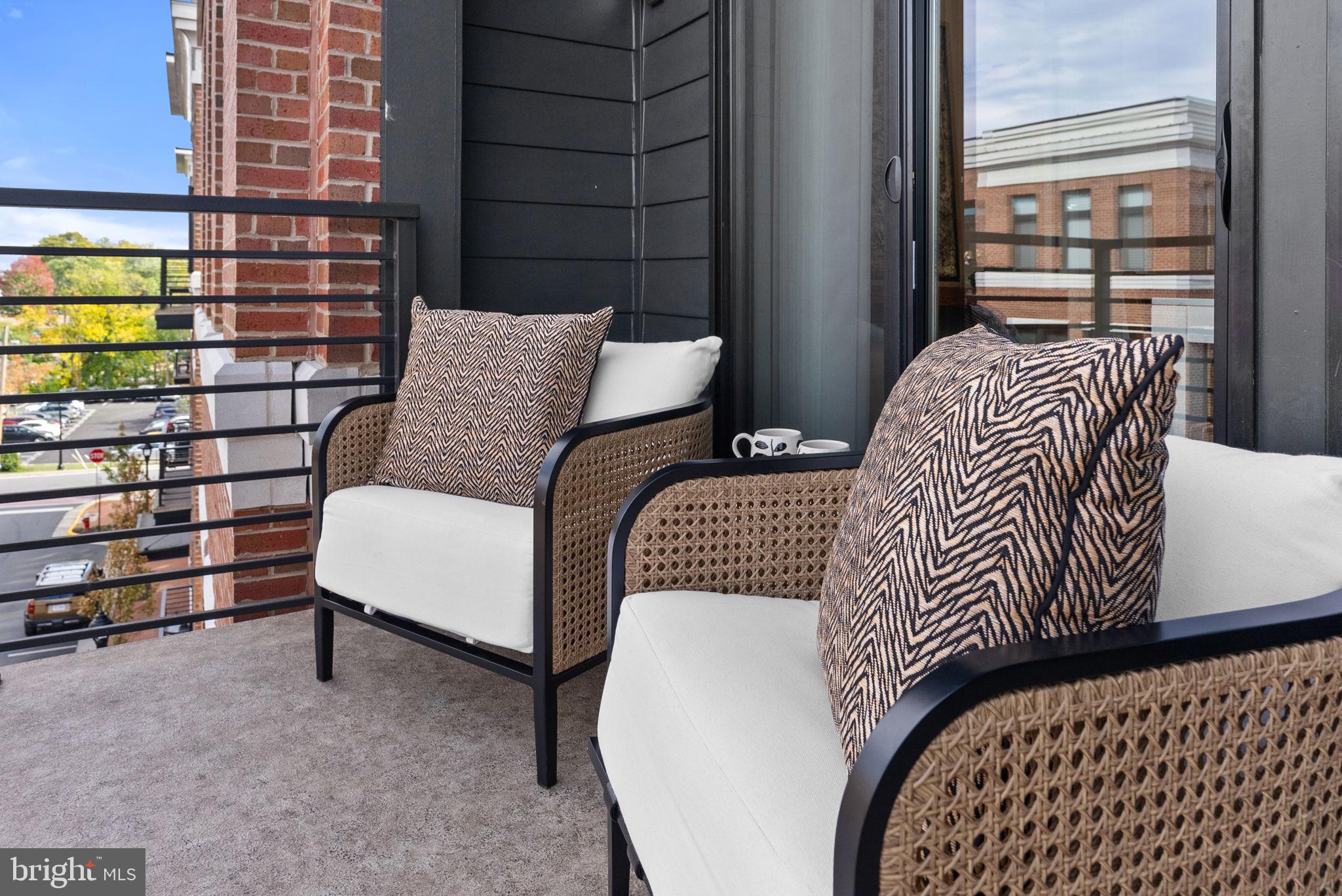 3 Stationmaster Street Southeast, Unit 402 Leesburg, VA 20175 - Photo 30 of 46 a view of a bedroom with furniture and window