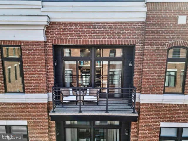 a view of a bedroom with furniture and window