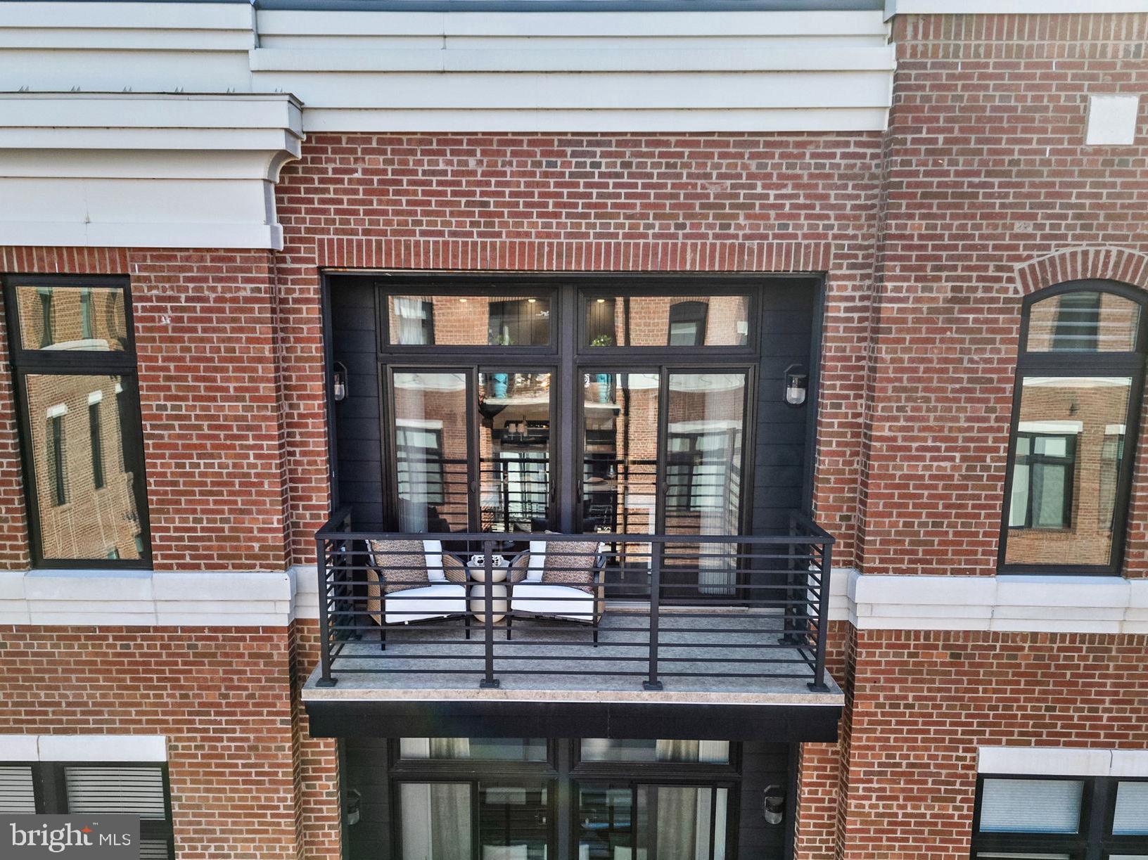 3 Stationmaster Street Southeast, Unit 402 Leesburg, VA 20175 - Photo 32 of 46 a front view of a building with large windows