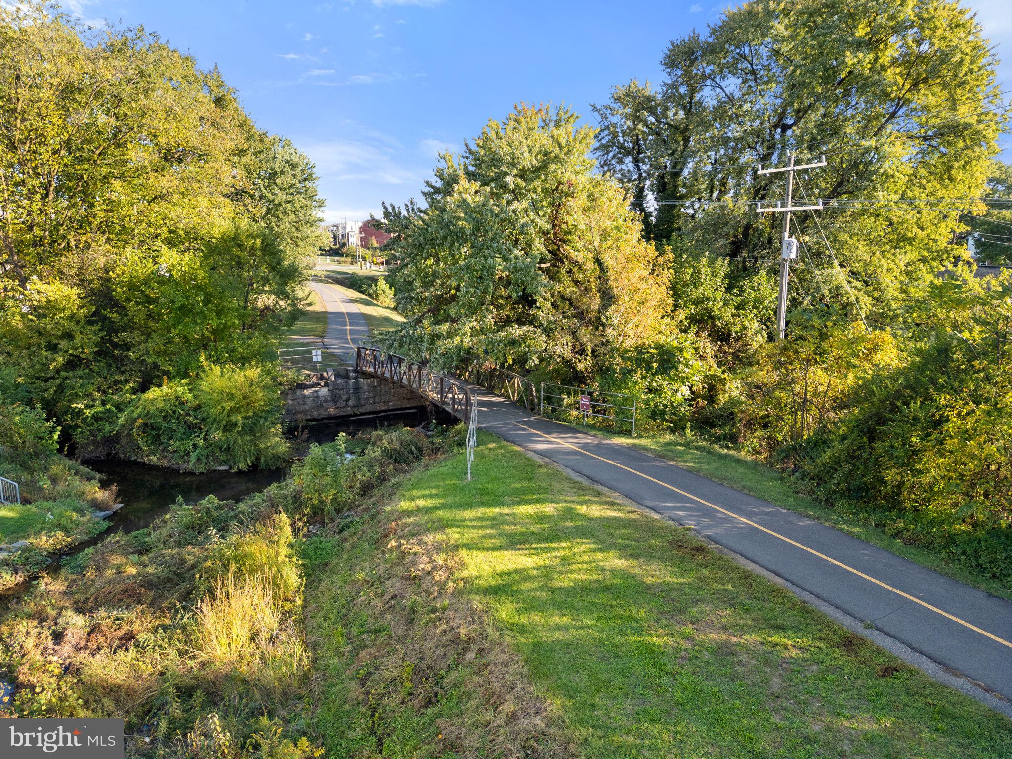 3 Stationmaster Street Southeast, Unit 402 Leesburg, VA 20175 - Photo 40 of 46 a view of a yard with plants and large trees