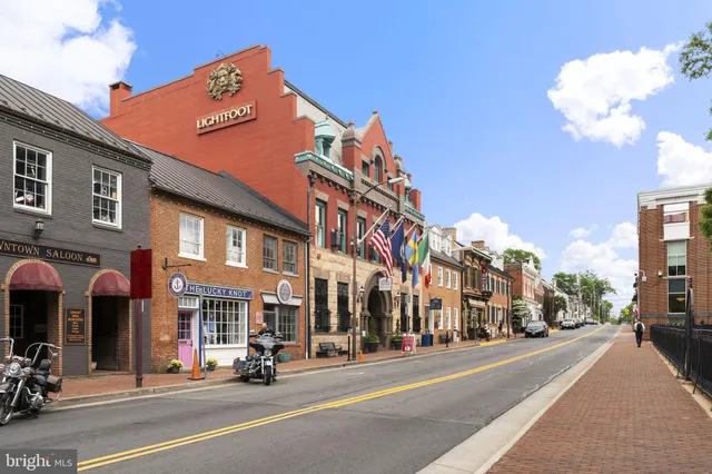 a view of a street with a building in the background