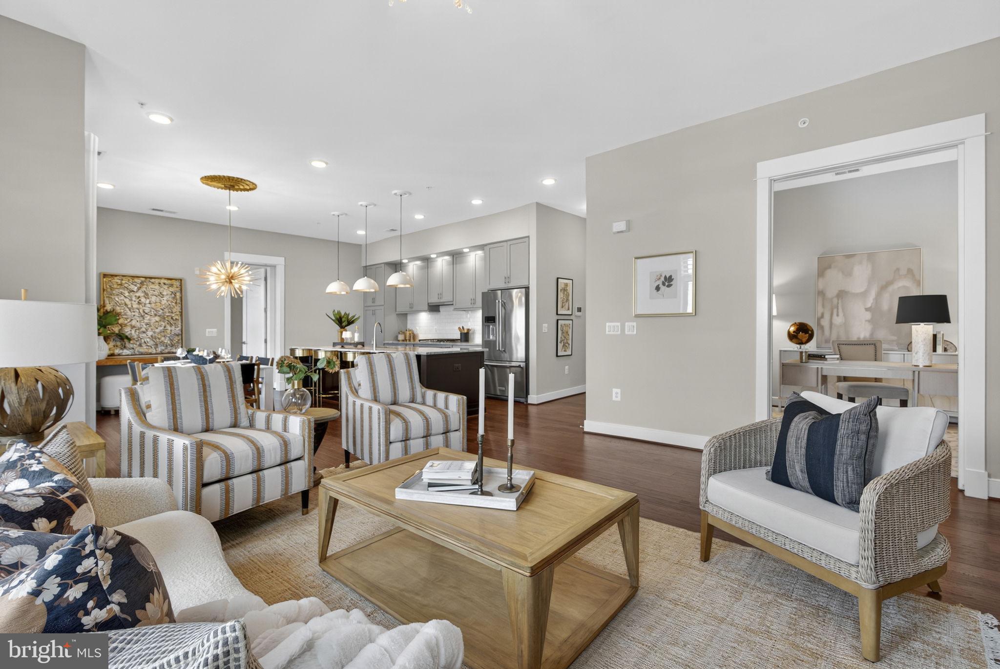 3 Stationmaster Street Southeast, Unit 402 Leesburg, VA 20175 - Photo 45 of 46 a living room with furniture and a table
