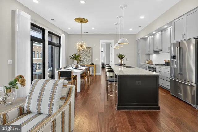 a living room with furniture fireplace and flat screen tv