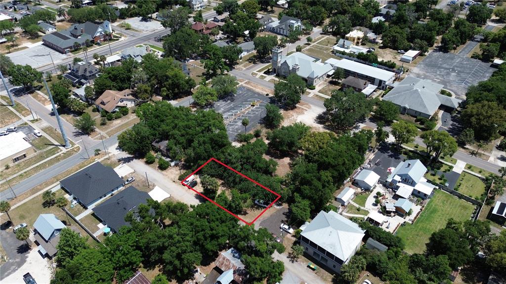 Dewitt Court Eustis, FL 32726 - Photo 7 of 8 an aerial view of residential house with outdoor space and swimming pool