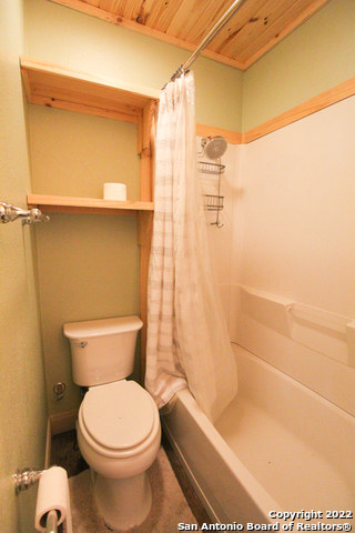 955 Faurie Road, Unit TINY HOUSE Lakehills, TX 78063 - Photo 13 of 23 a bathroom with a toilet and a shower