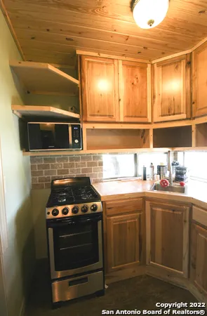 a kitchen with a stove and a microwave