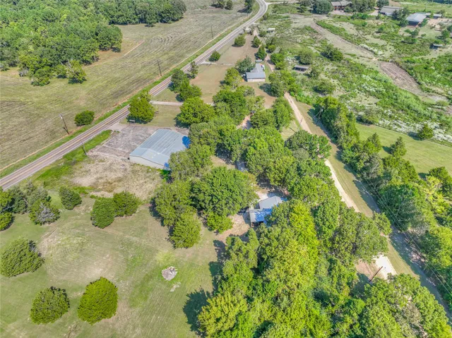 a view of backyard with a garden and deck