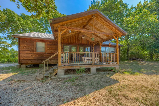 a backyard of a house with plants and trees