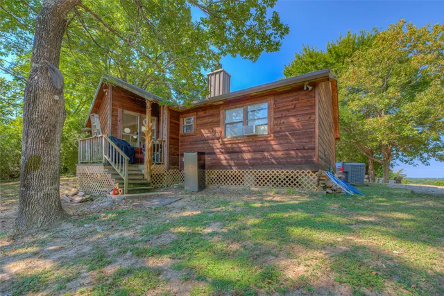a view of a park with large trees