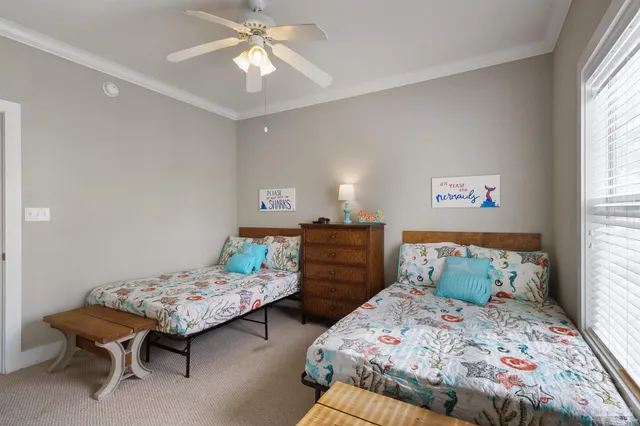 a bedroom with a bed and a table in it