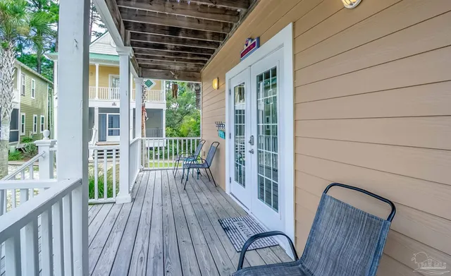 a view of porch with wooden floor and outdoor seating