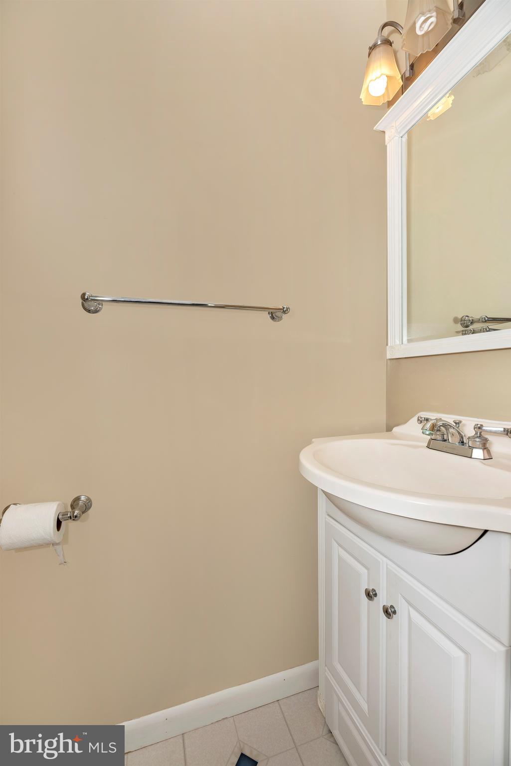 17417 Hoskinson Road Poolesville, MD 20837 - Photo 22 of 45 a bathroom with a sink a vanity and a mirror